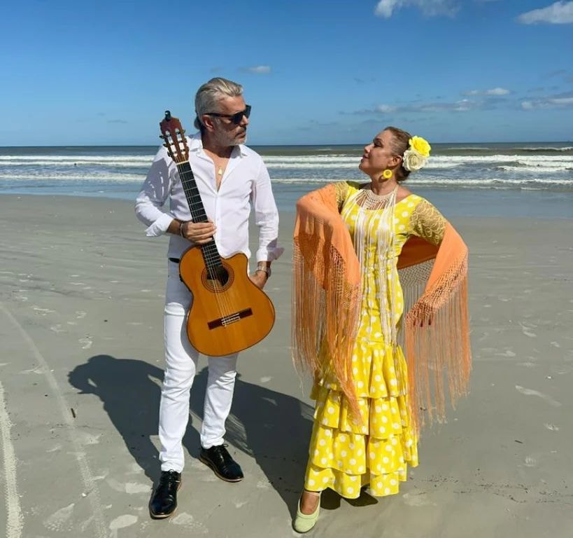 Flamenco duo on the beach with guitar